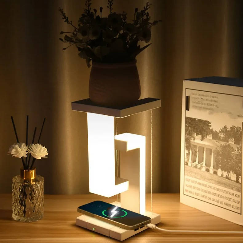 Schwebende Tischlampe mit kabellosem Ladegerät für Nachttisch, Schreibtisch und Wohnzimmer – Leuchtkörper mit Schwebe-Effekt, Ladefläche im Sockel