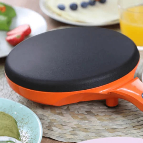 Elektrischer Crêpes-Maker mit Stiel zum Eintauchen in den Teig für dünne Crêpes, Pfannkuchen und Wraps – runde Antihaft-Platte, Orange